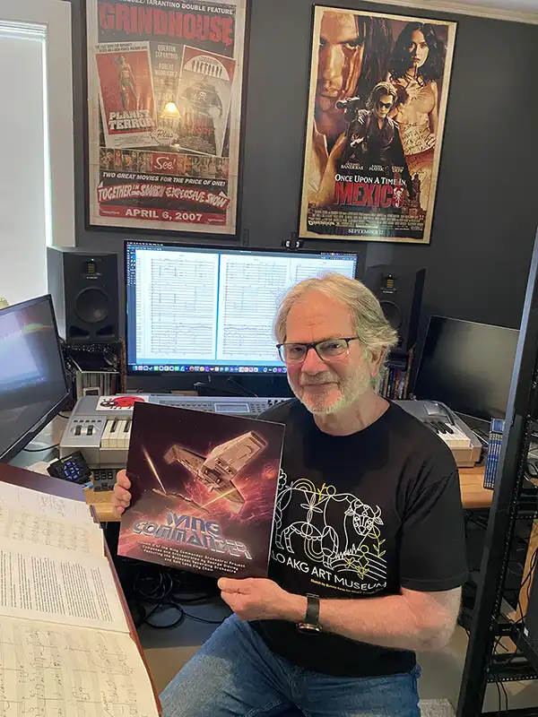 George Oldziey holding the vinyl album for his Wing Commander 2 sessions.